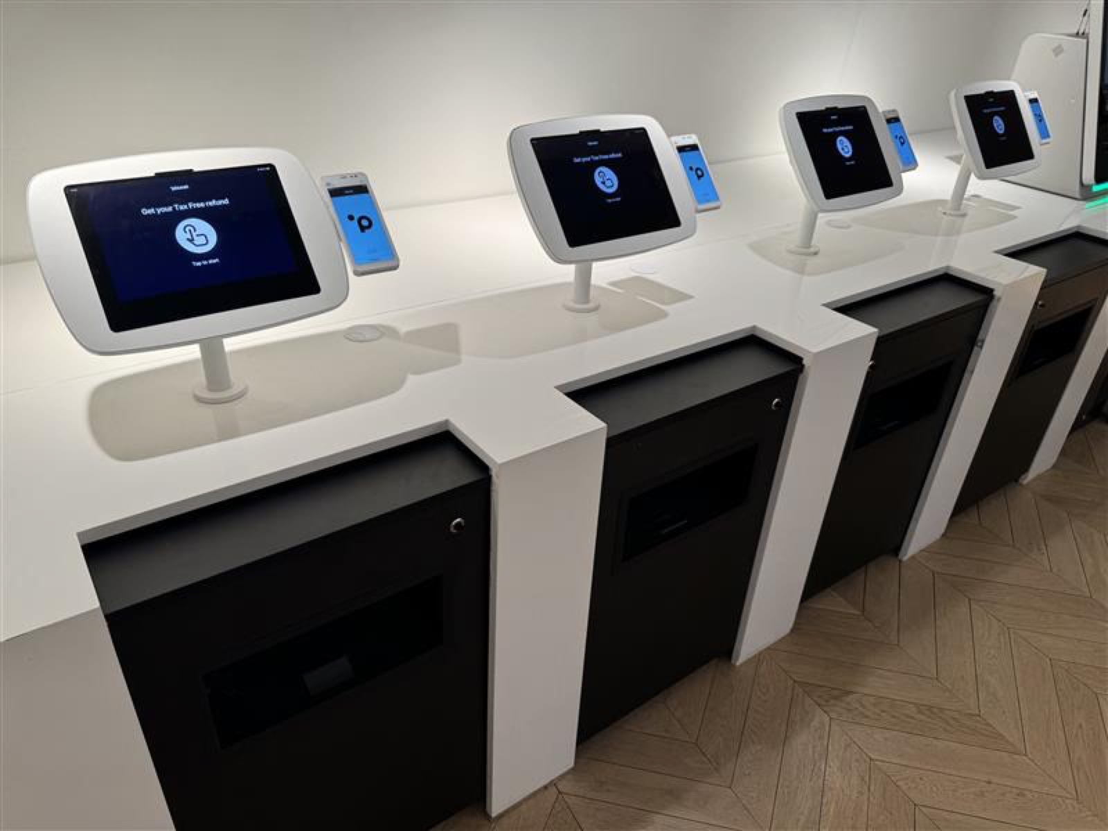 Close view of kiosks showing the Tax Free start screen